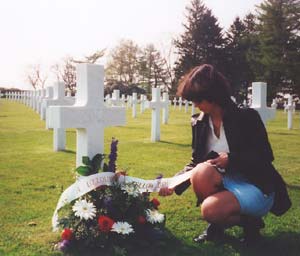 REGINE PLACING FLOWERS