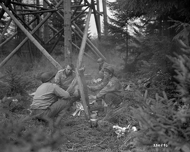 US Soldiers around a campfire